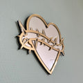 Lekky Studio's Exclusive Heart Mirror: Unique thorn design in traditional tattoo style, with luxurious gold and silver accents. Size: 29x22cm. Hand-assembled, laser-cut acrylic for a bespoke artistic touch to your decor.