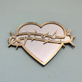 Lekky Studio's Exclusive Heart Mirror: Unique thorn design in traditional tattoo style, with luxurious gold and silver accents. Size: 29x22cm. Hand-assembled, laser-cut acrylic for a bespoke artistic touch to your decor.